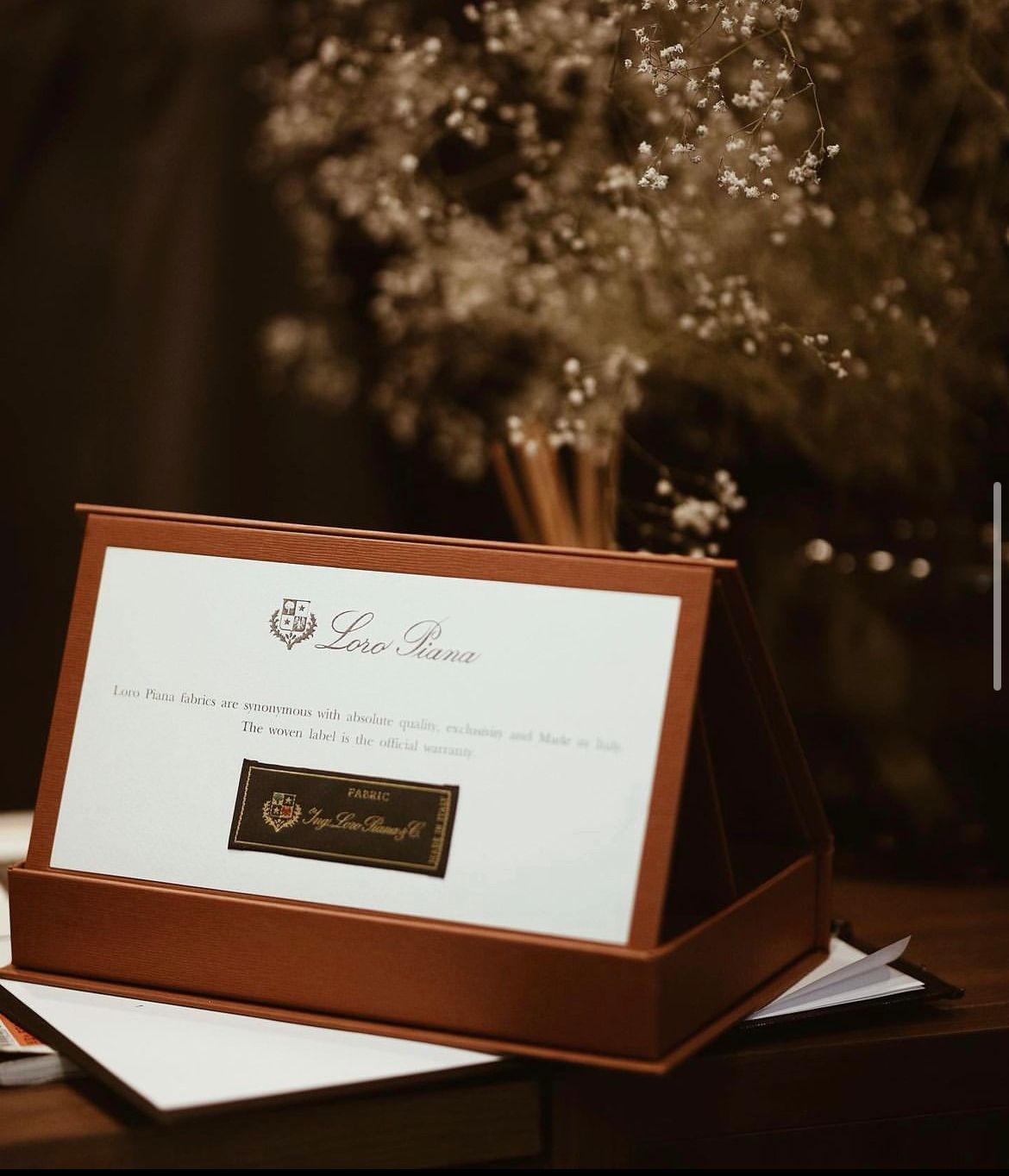 Open Loro Piana presentation case on a table
