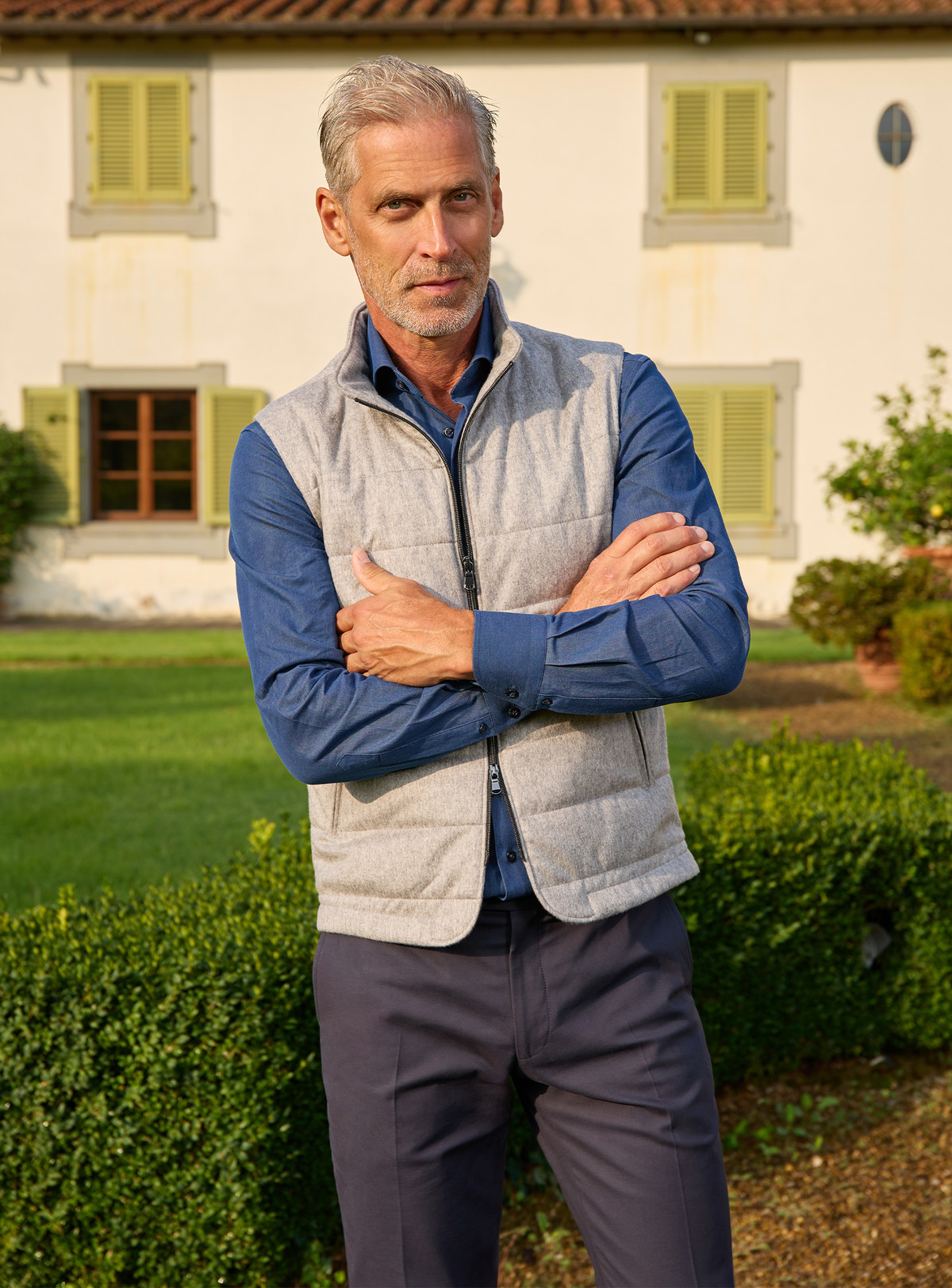 Consiglieri: light grey quilted gilet over a blue shirt