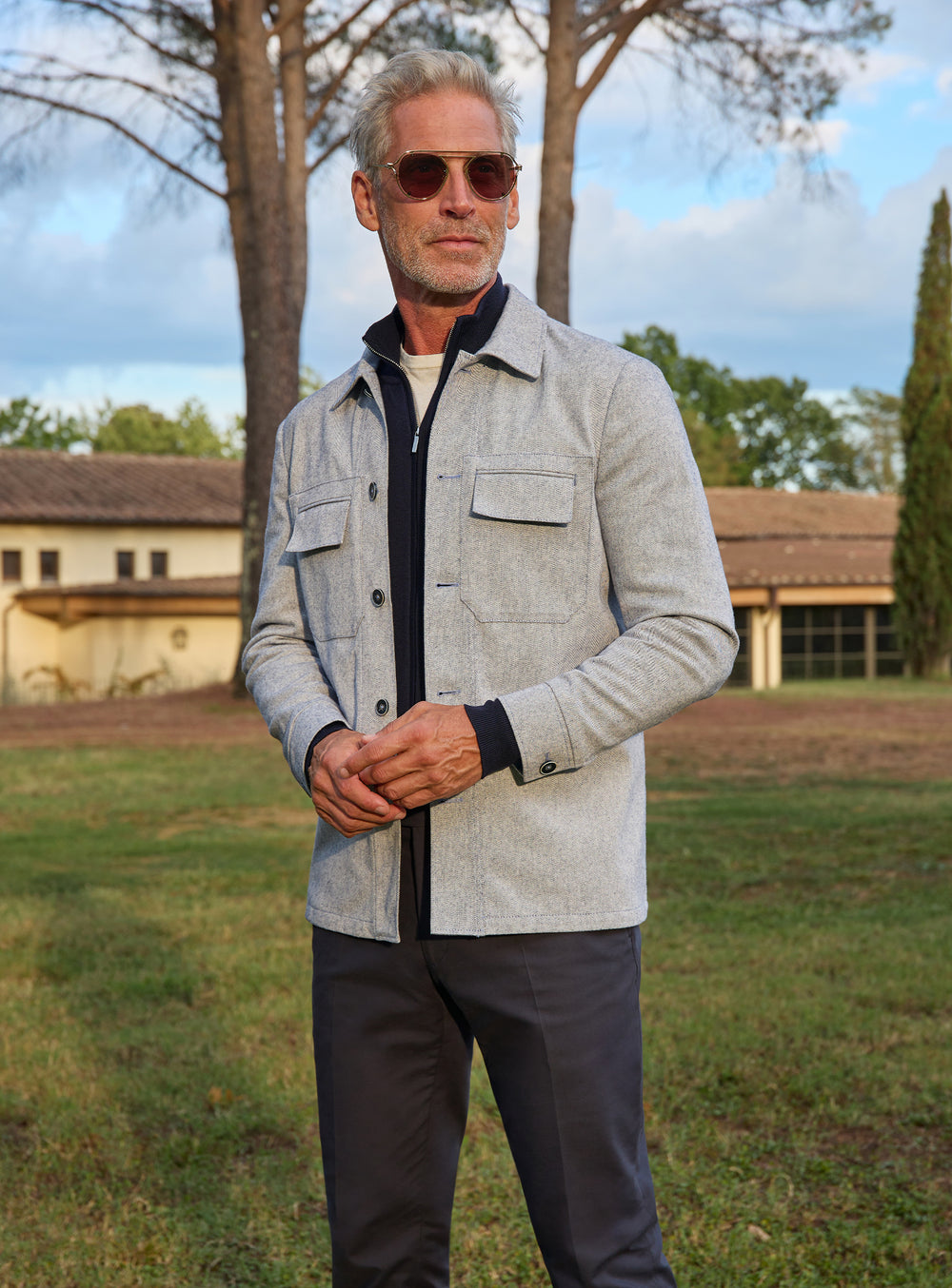 Consiglieri: light grey chest-pocket jacket with dark trousers