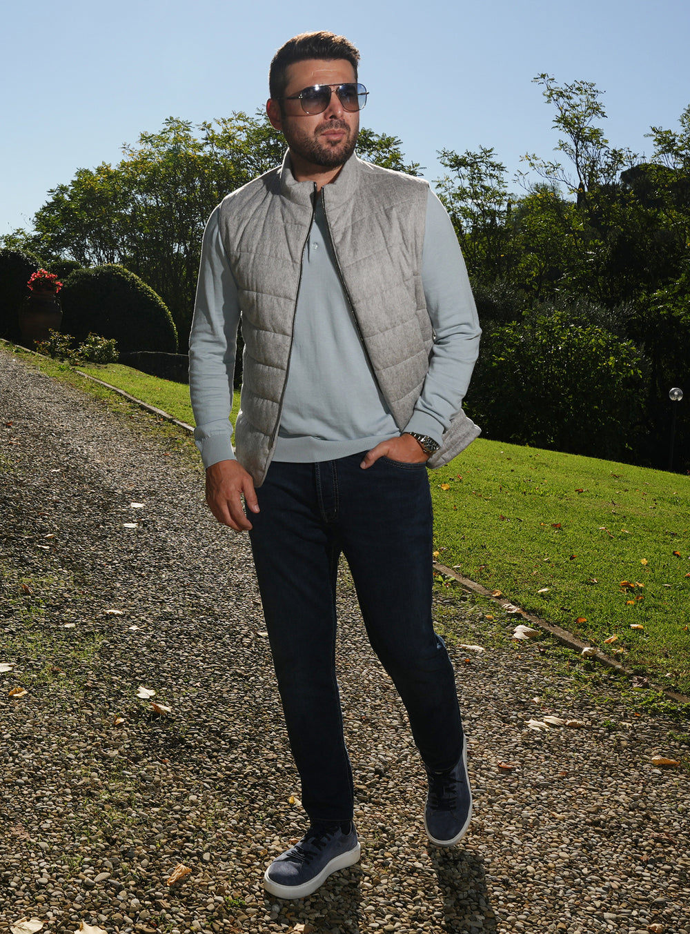 Navy Consiglieri jeans worn with a grey gilet and pale blue sweater