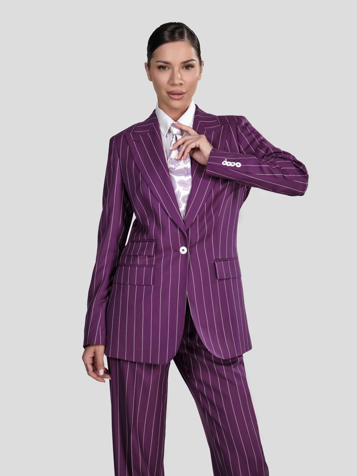 Purple pinstriped Consiglieri DONNA women's suit worn with a patterned shirt
