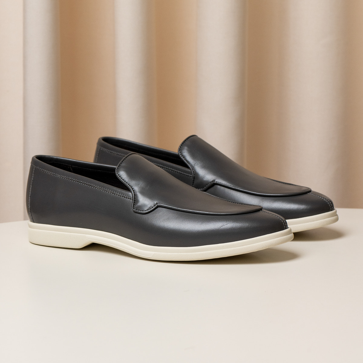 Consiglieri: dark grey loafers with a smooth finish and cream soles