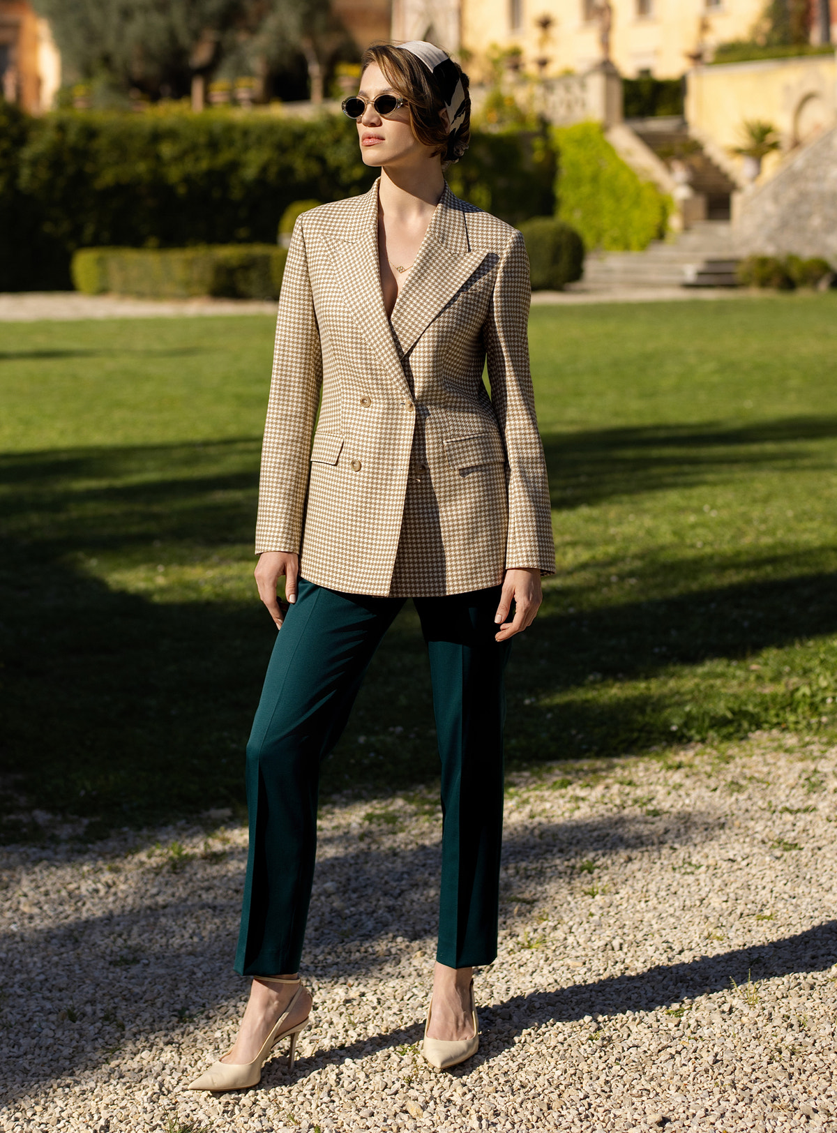 Beige double-breasted Consiglieri DONNA blazer worn with dark green tapered trousers