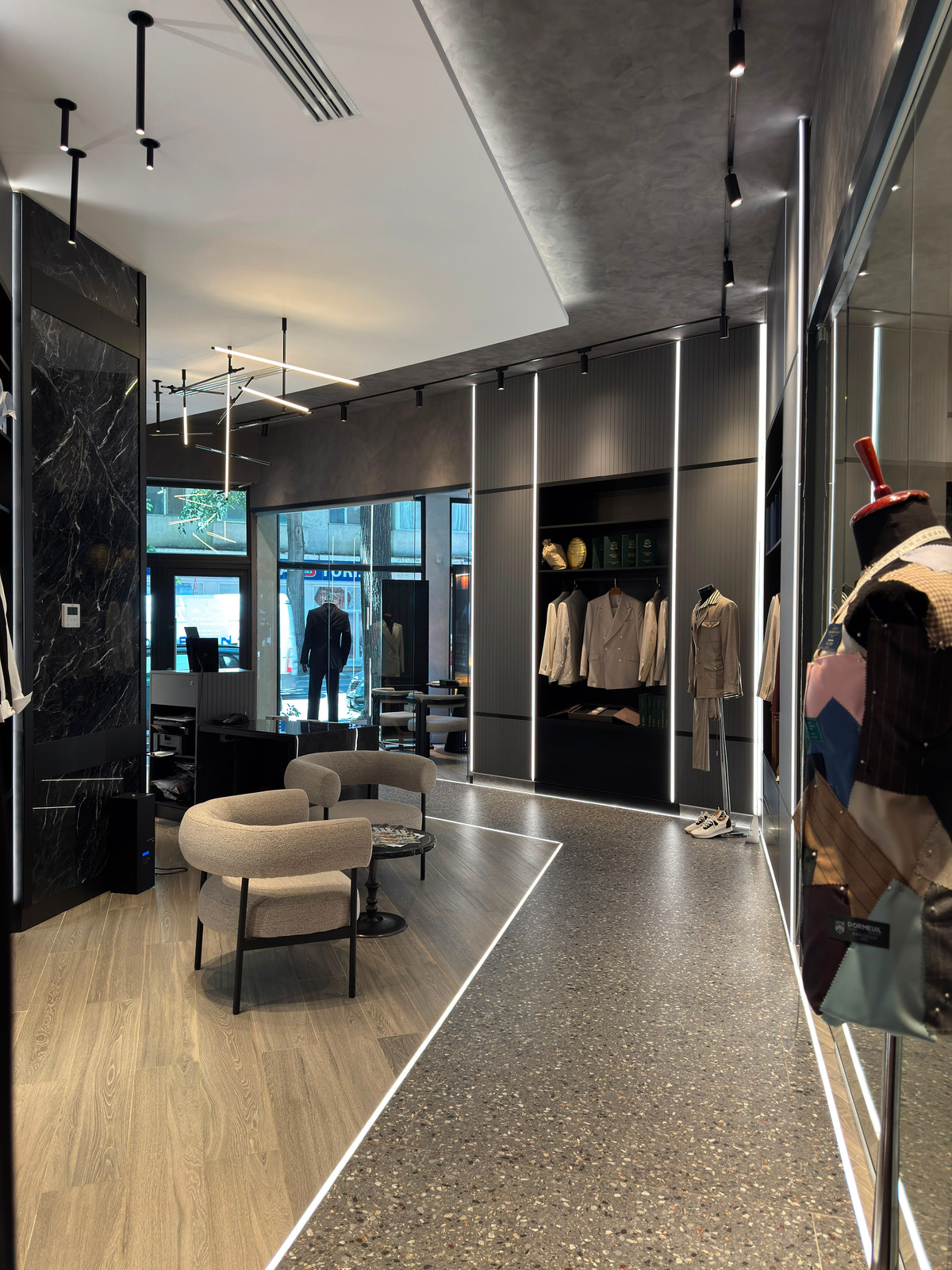 The seating area beside the storefront window, set against a dark interior.