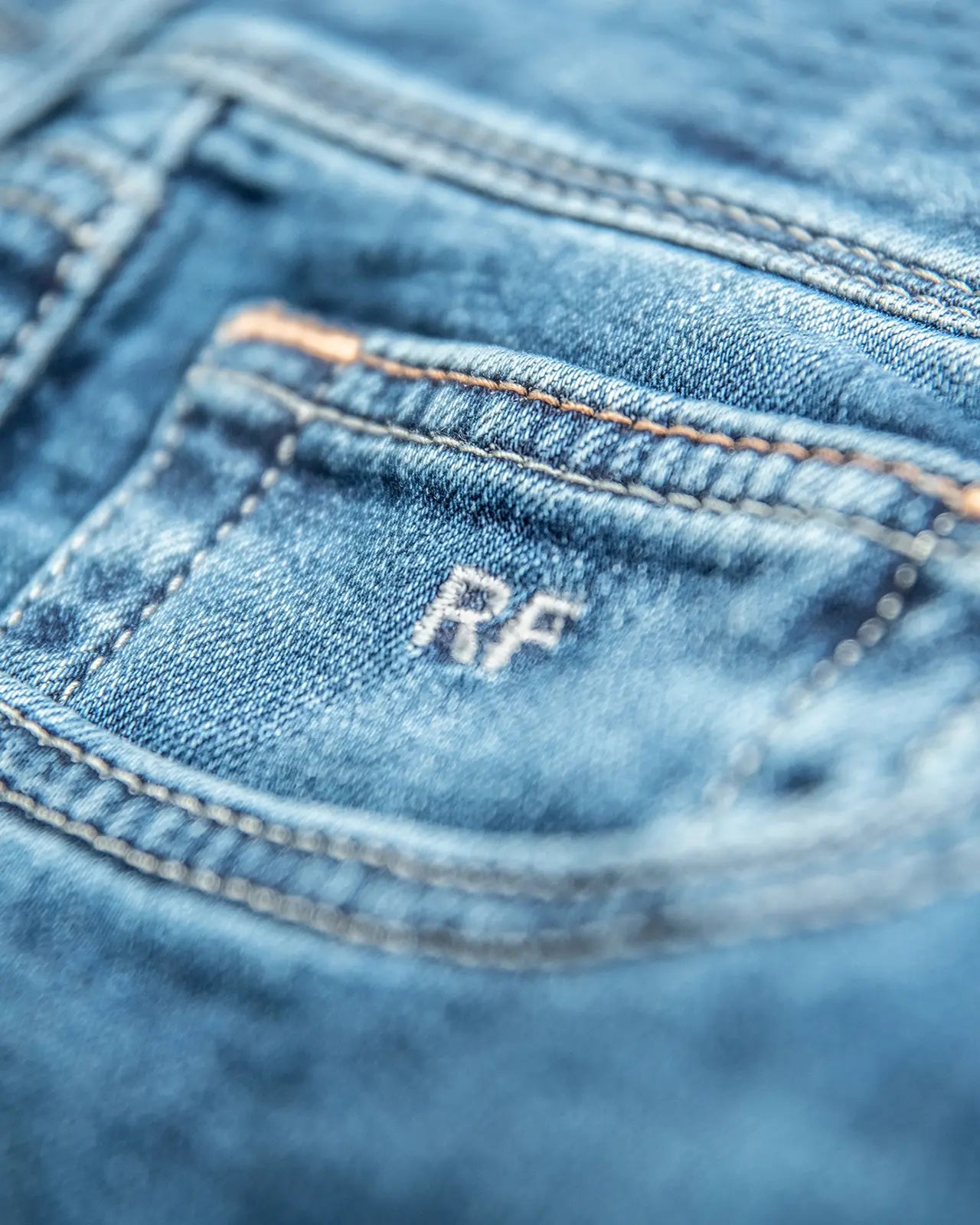 Personalised initials, discreetly applied — the signature of Custom Made Jeans.