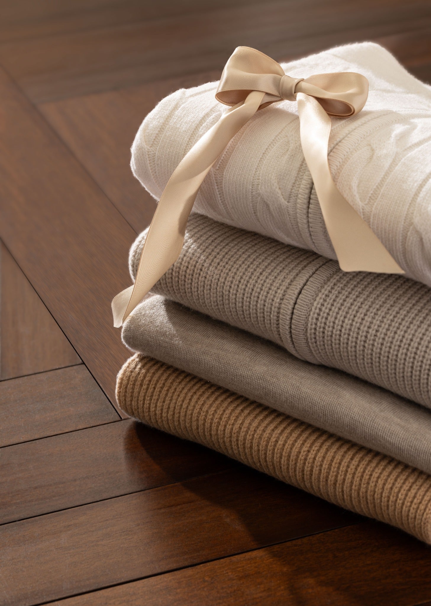 Knitwear in ivory, taupe and camel — an edit of textures for the new season.