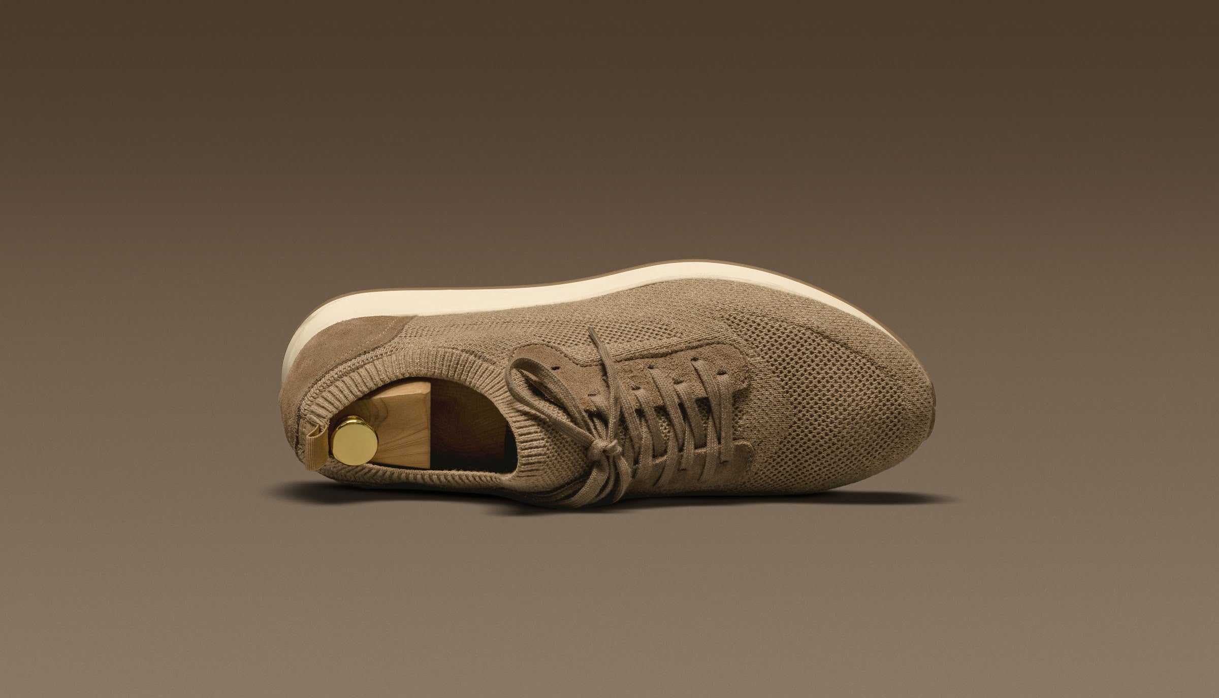 The Runners by Consiglieri in sand technical knit and suede — the clean profile, seen up close.