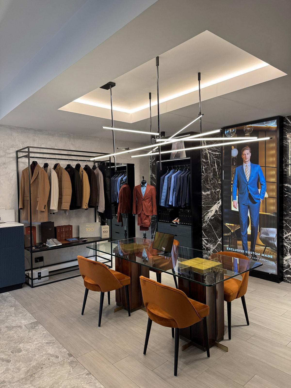 The consultation area beneath geometric pendant lighting.