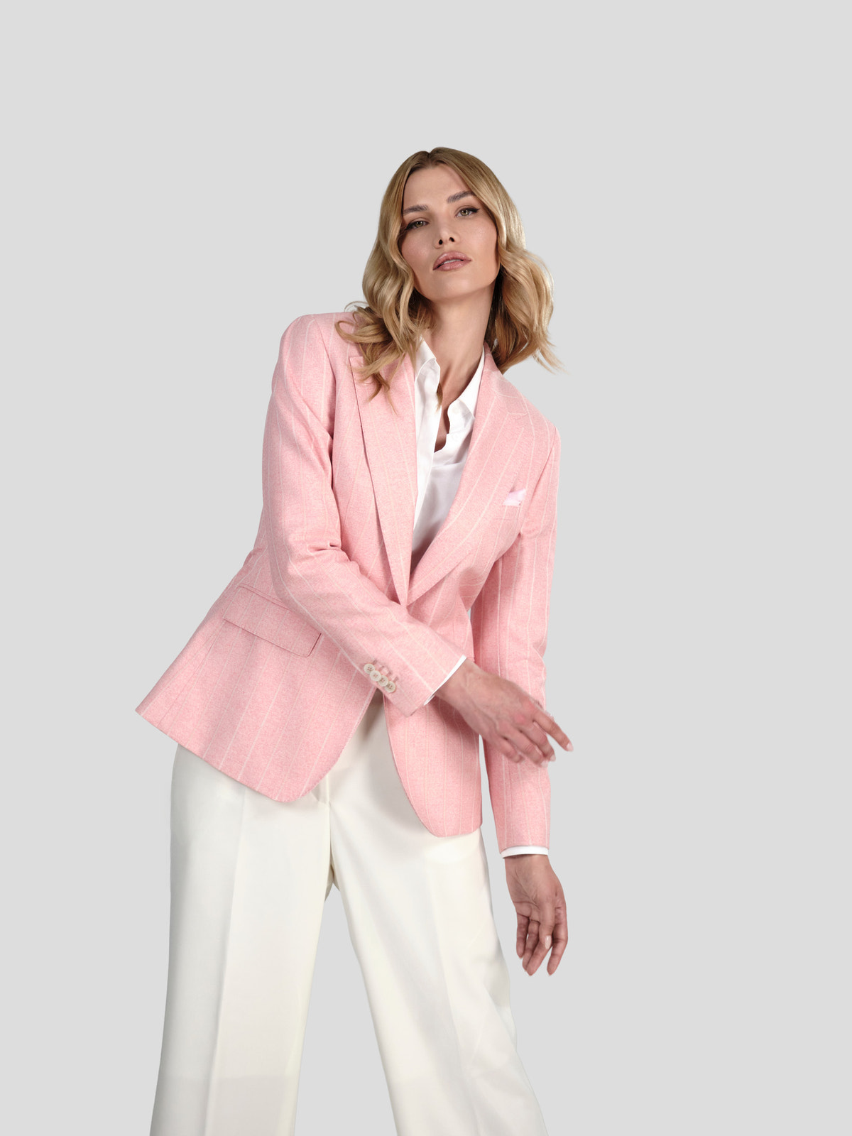 Pale pink Consiglieri DONNA blazer with a white shirt and cream wide-leg trousers