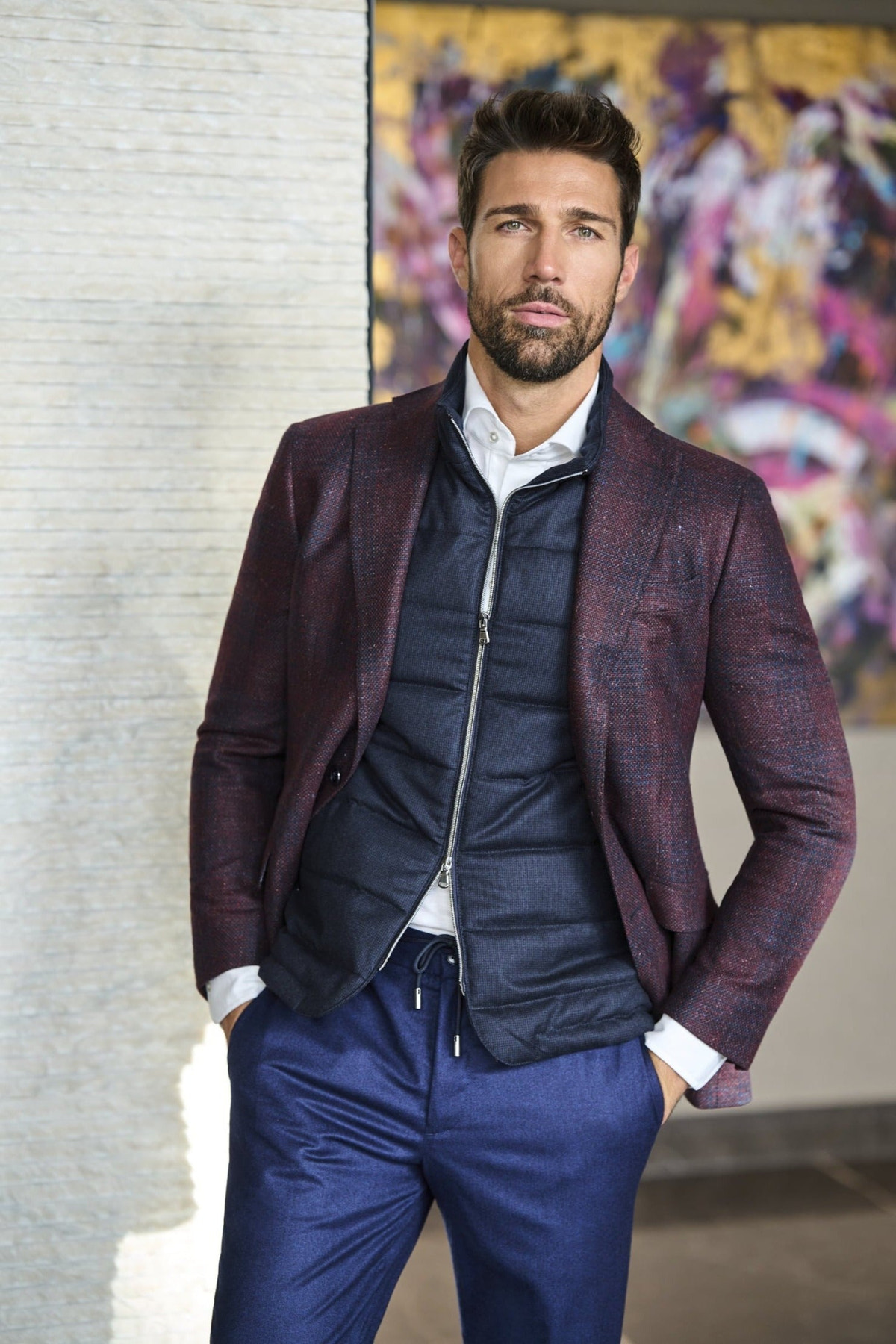 Consiglieri: navy zip-front gilet beneath a checked jacket