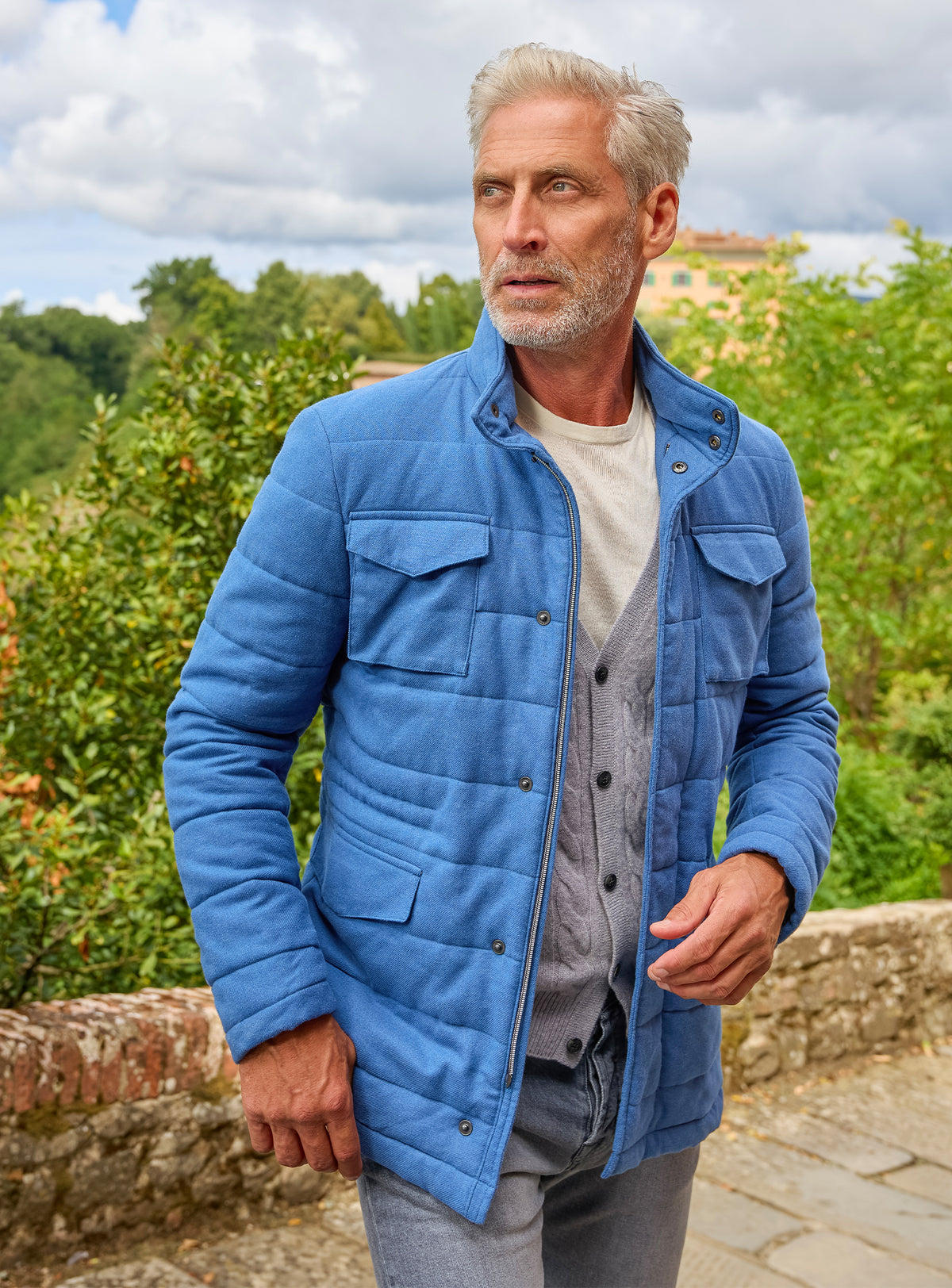 Consiglieri: blue quilted field jacket with patch pockets and a grey cardigan