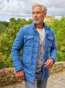 Consiglieri: blue quilted field jacket with patch pockets and a grey cardigan