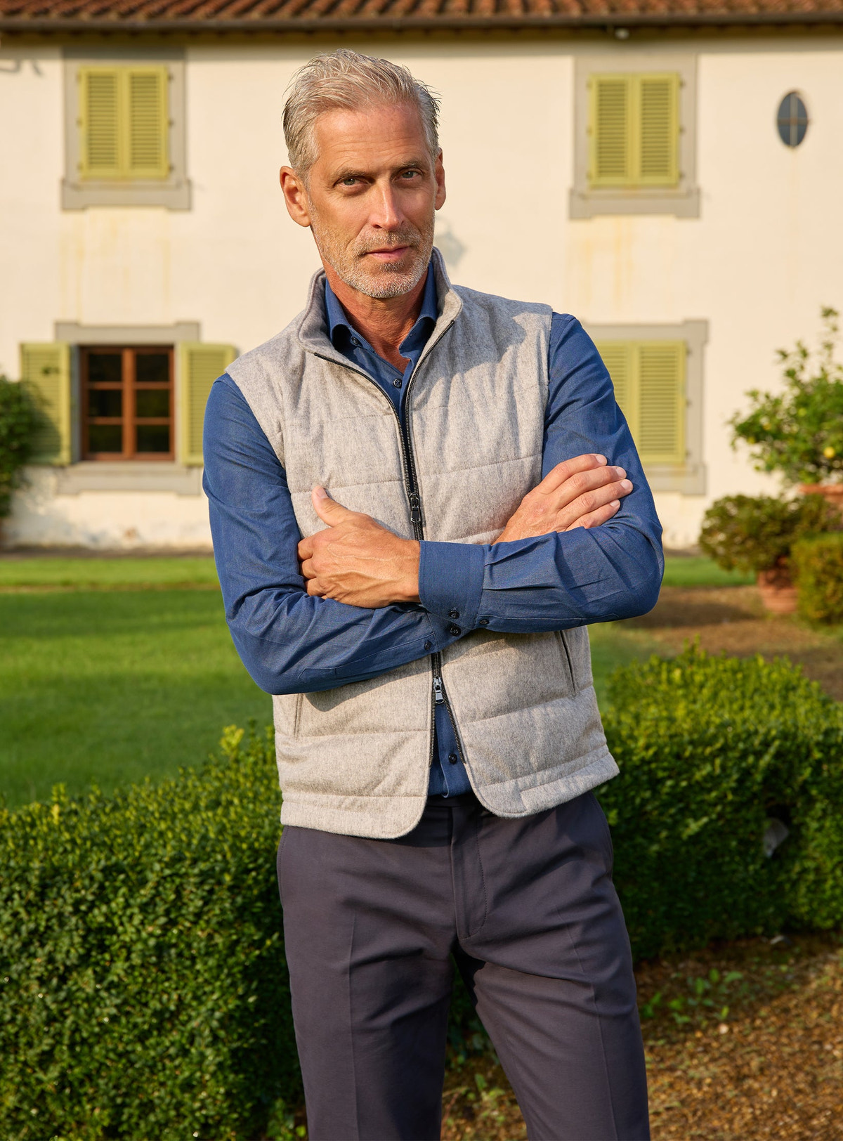 Consiglieri: light grey quilted gilet over a blue shirt