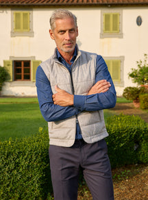 Consiglieri: light grey quilted gilet over a blue shirt