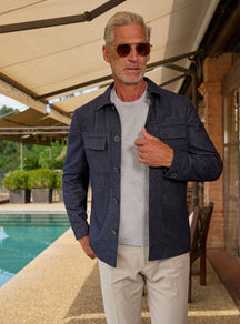 Consiglieri: navy chest-pocket jacket with a grey T-shirt and cream trousers