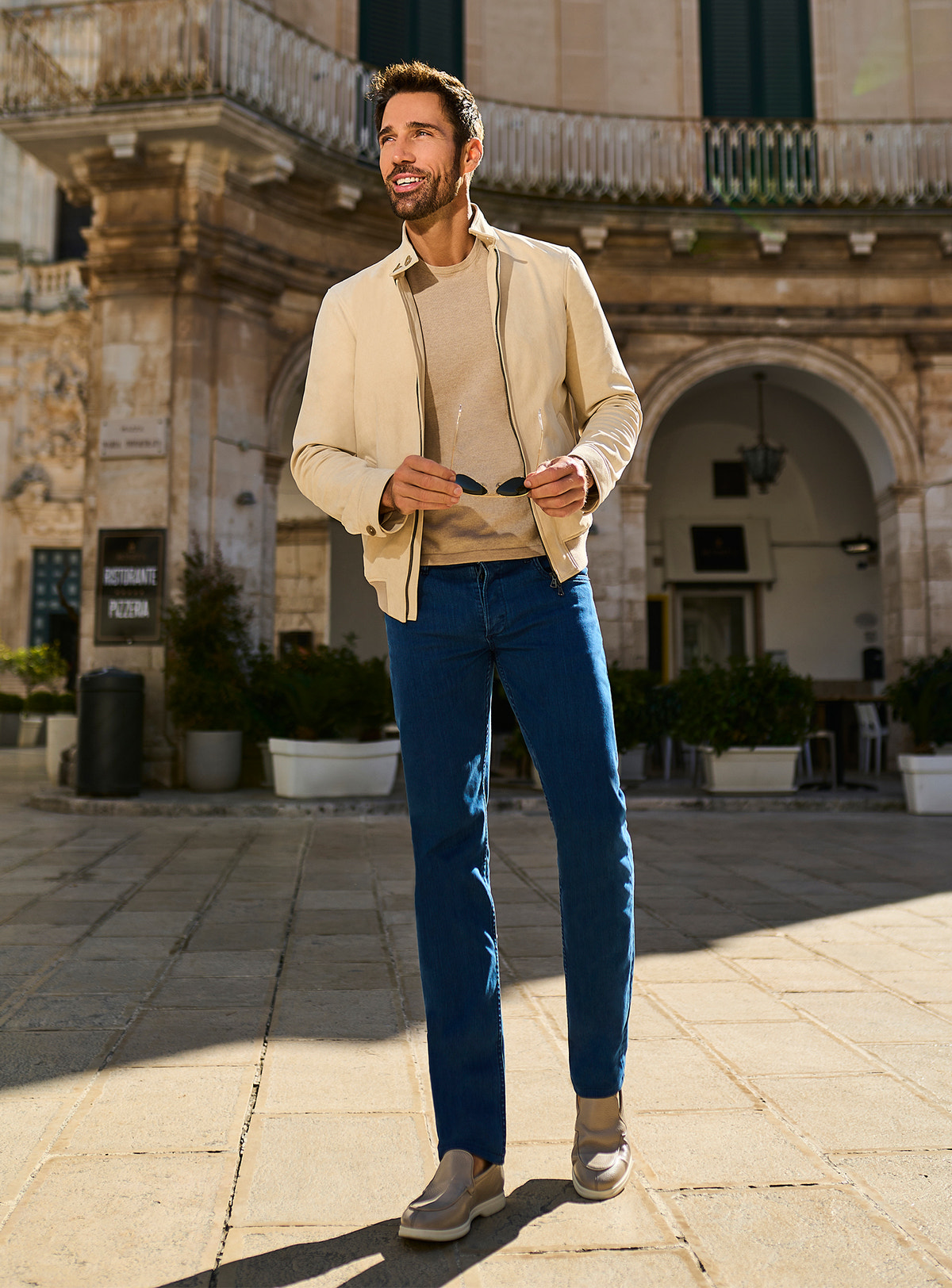 Consiglieri: blue jeans with a cream jacket and neutral knitwear