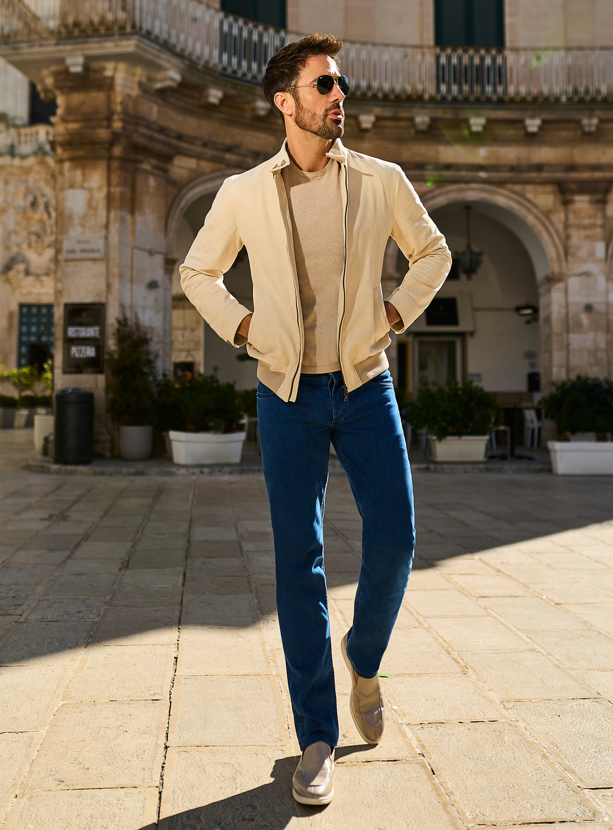 Consiglieri: blue jeans with a cream jacket and neutral knitwear