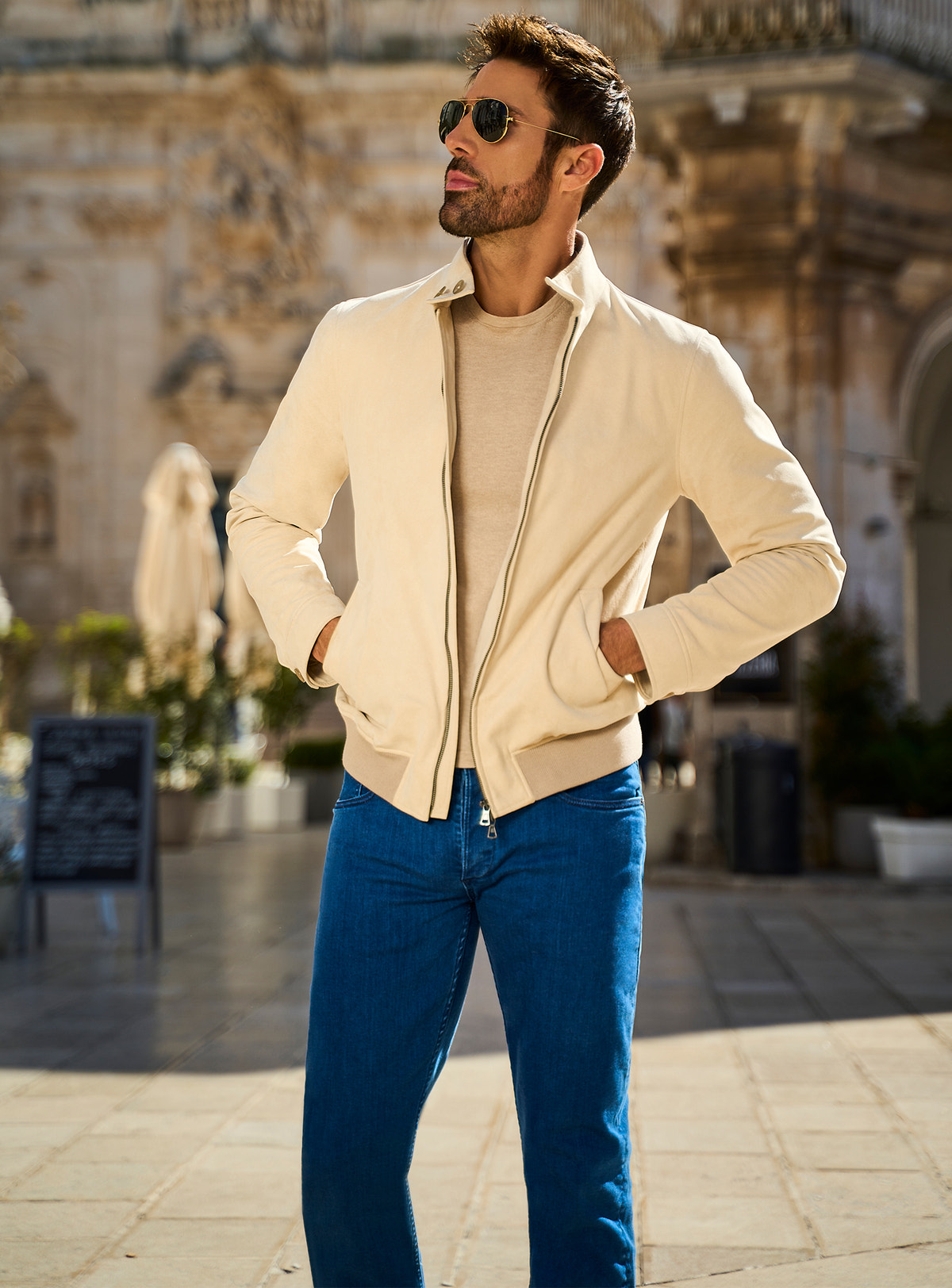 Consiglieri Milano Chic: cream zip-front jacket, neutral knitwear and blue trousers