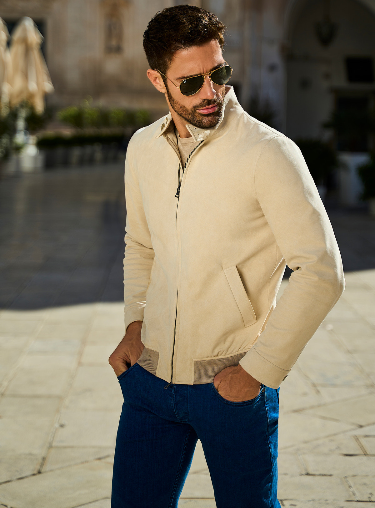 Consiglieri: blue jeans with a cream jacket and neutral knitwear