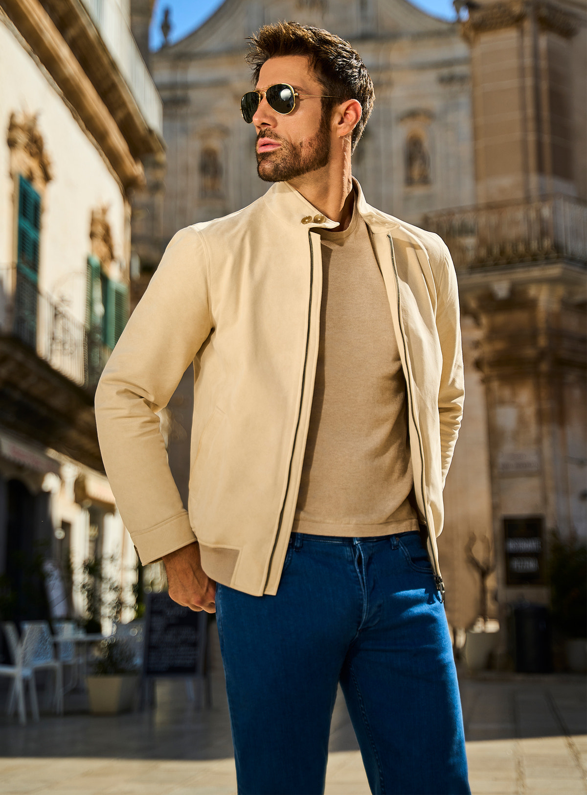 Consiglieri Milano Chic: cream zip-front jacket, neutral knitwear and blue trousers
