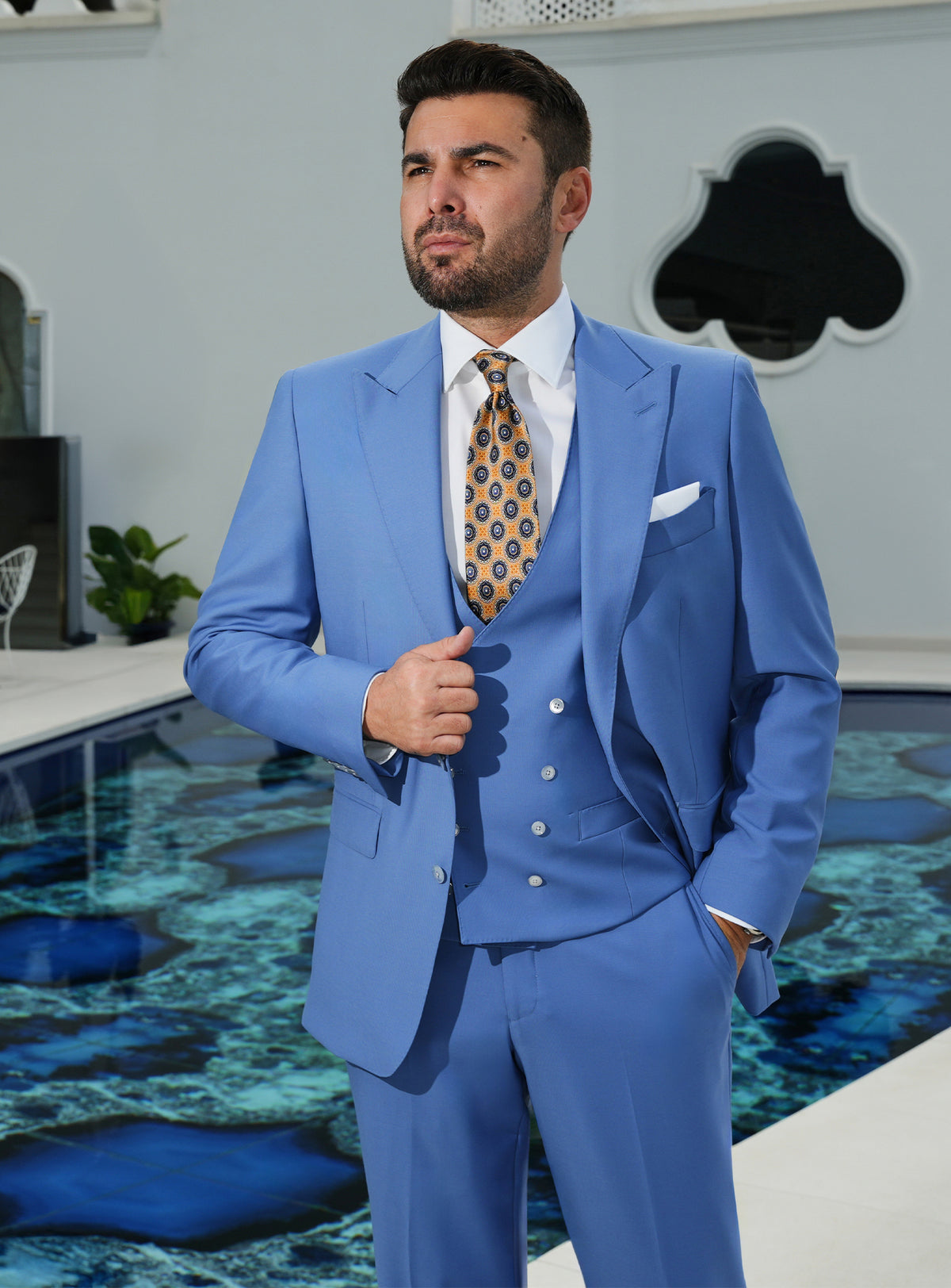 Blue three-piece Consiglieri suit with a double-breasted waistcoat and patterned tie
