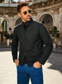 Consiglieri Genova Luxury: black zip-front jacket styled with blue jeans