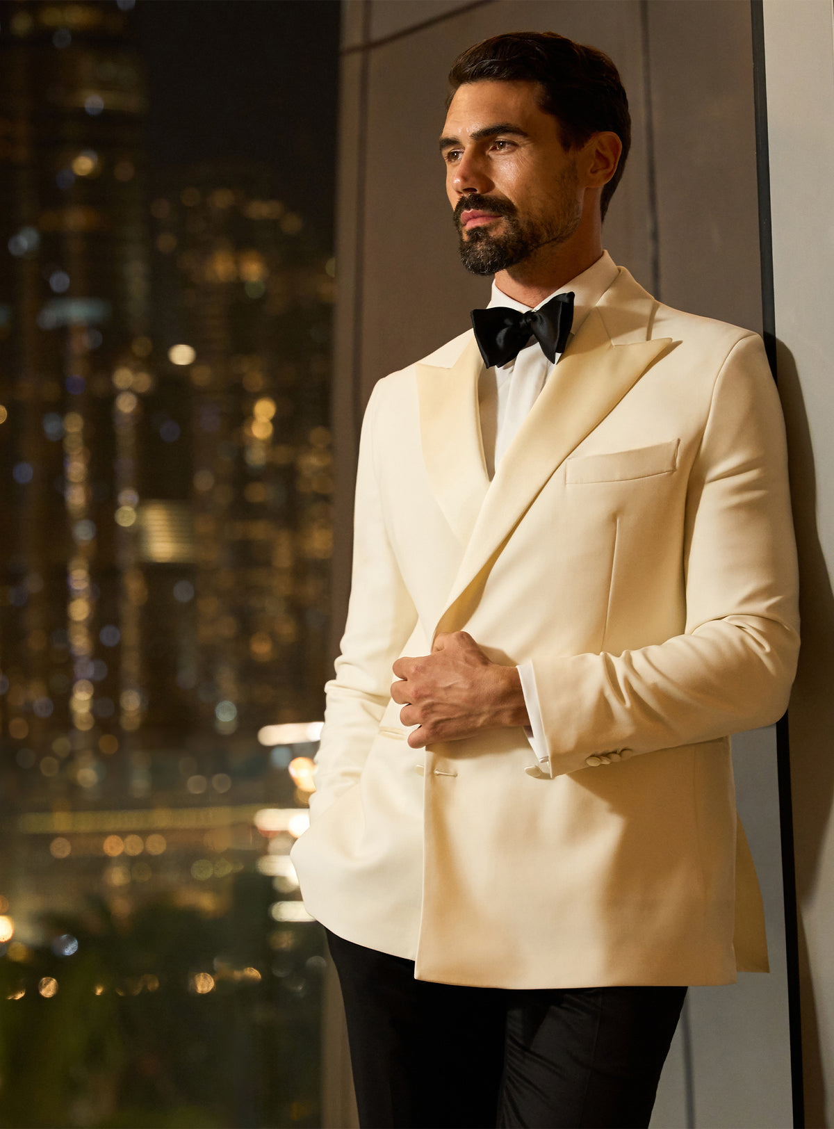 Ivory Consiglieri dinner jacket with a black bow tie and white shirt