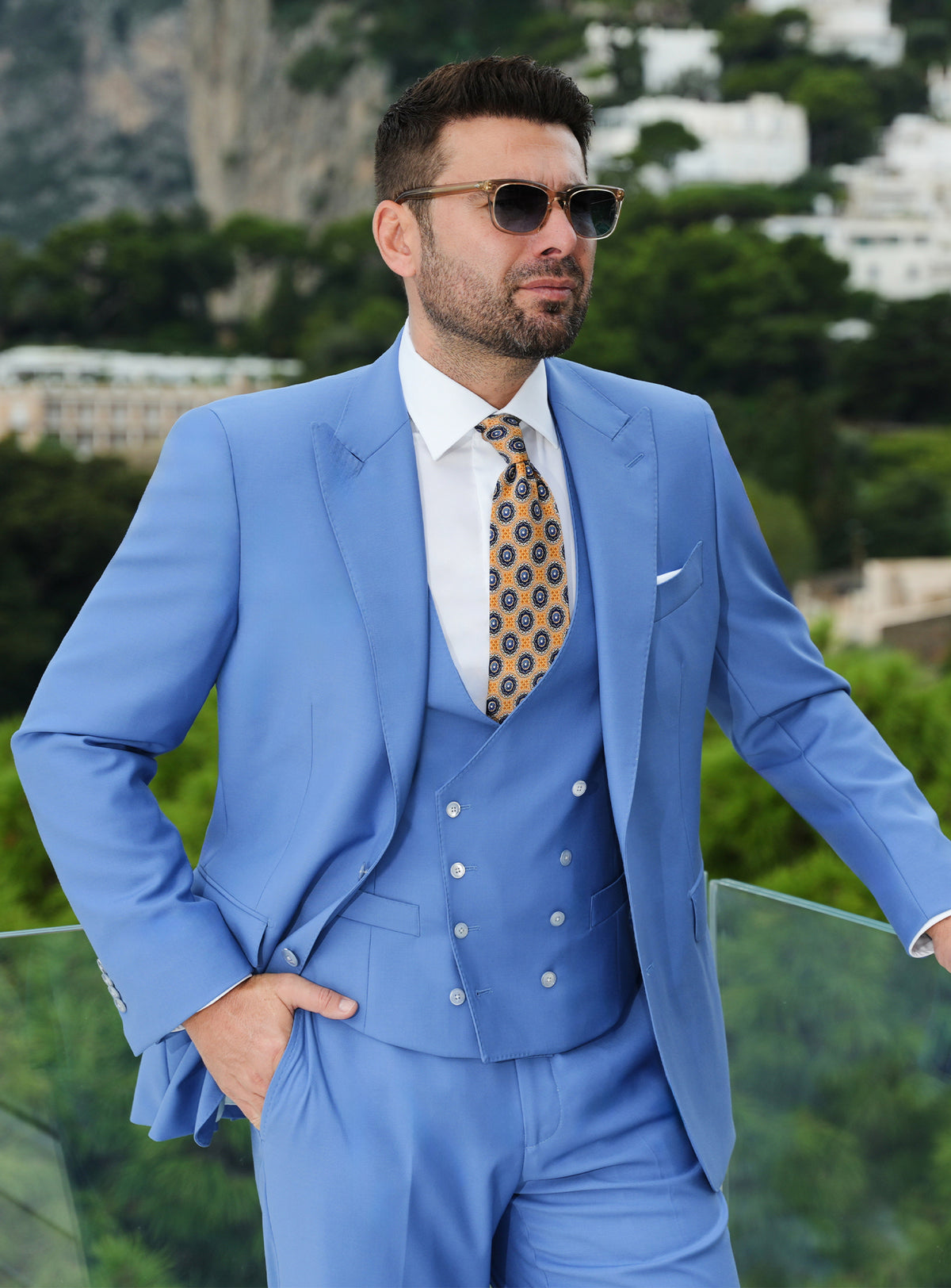 Blue three-piece Consiglieri suit with a double-breasted waistcoat and patterned tie