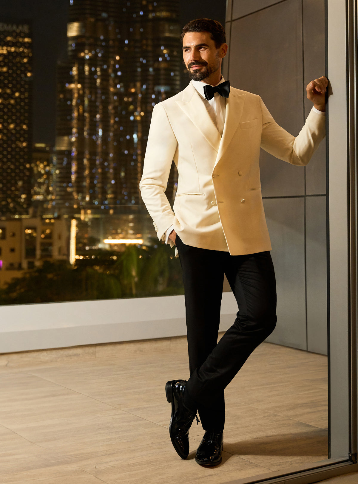 Ivory Consiglieri dinner jacket with a white shirt and black bow tie