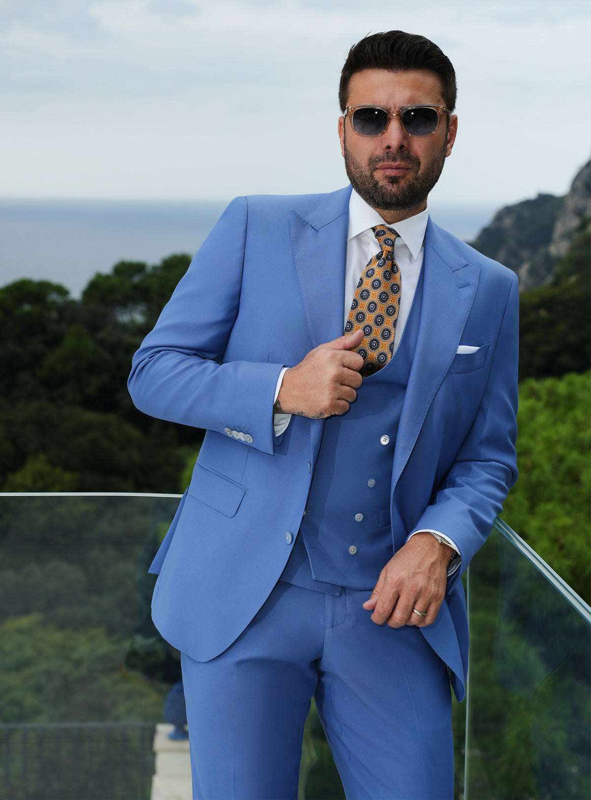 Blue three-piece Consiglieri suit with a double-breasted waistcoat and patterned tie