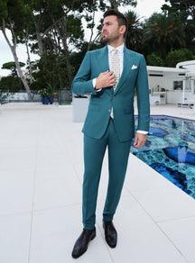 Teal Consiglieri suit worn with a white shirt and a light patterned tie