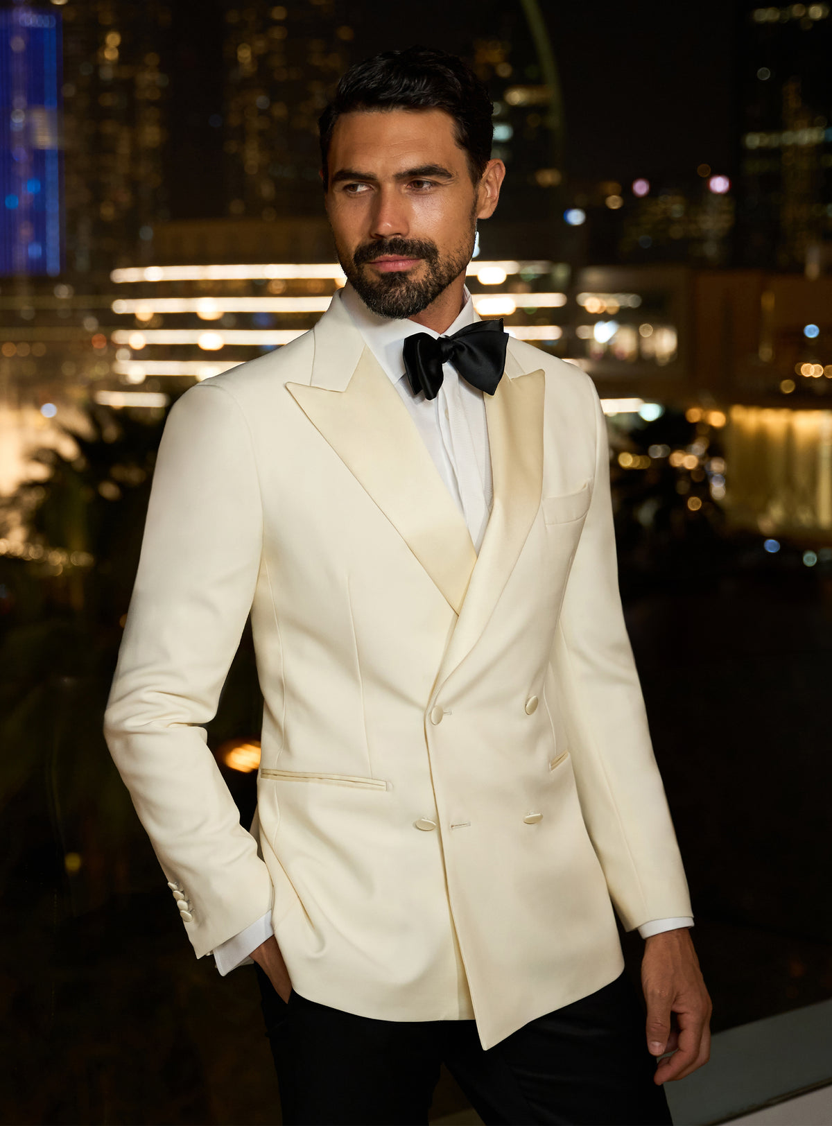 Ivory Consiglieri dinner jacket with a white shirt and black bow tie