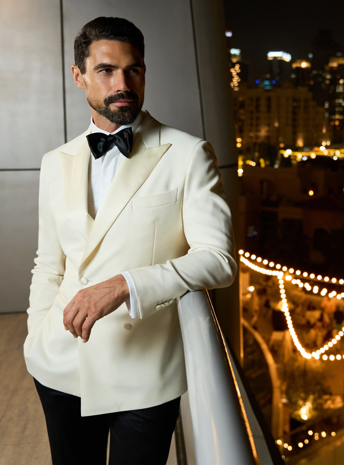 Ivory Consiglieri dinner jacket with a black bow tie and white shirt