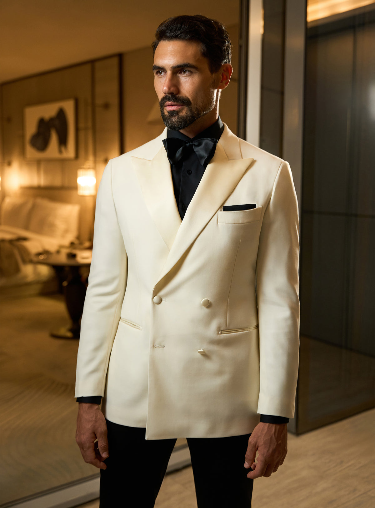 Ivory Consiglieri dinner jacket with a black shirt and matching pocket square