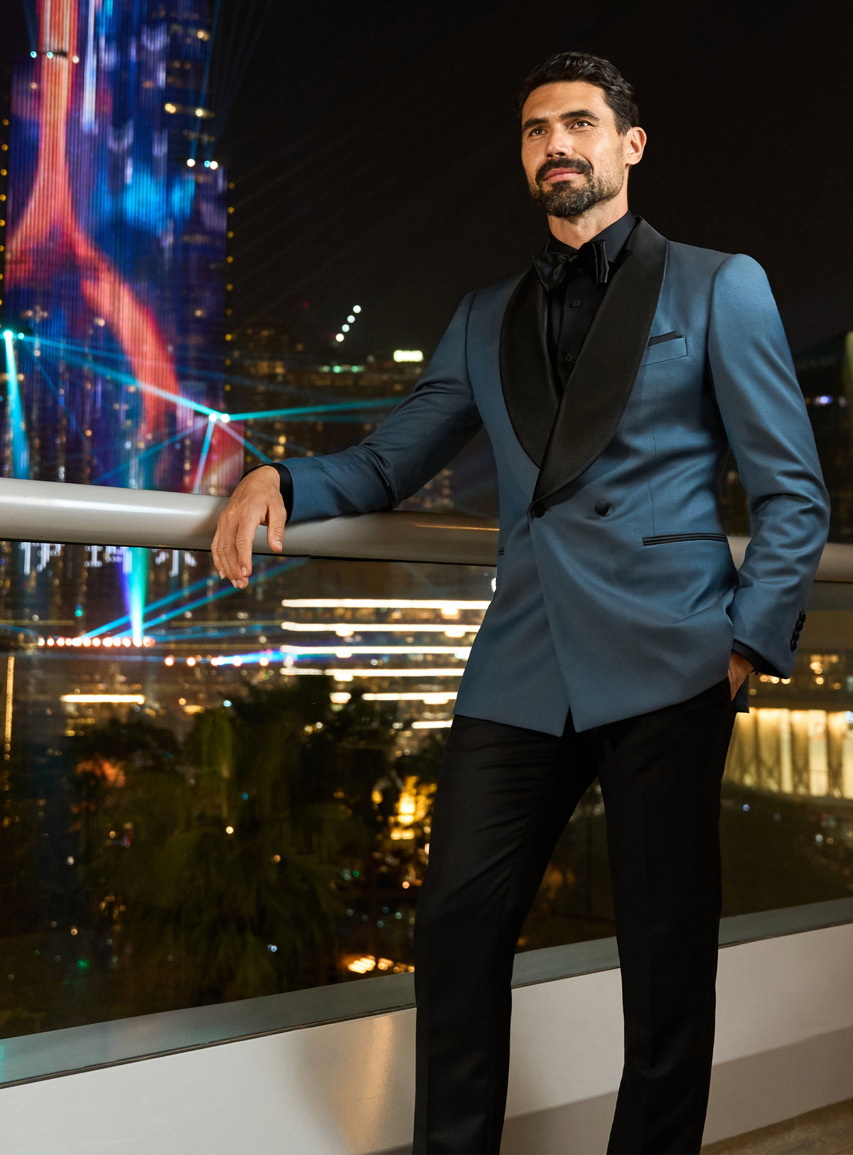 Consiglieri evening look with a petrol blue dinner jacket and black trousers