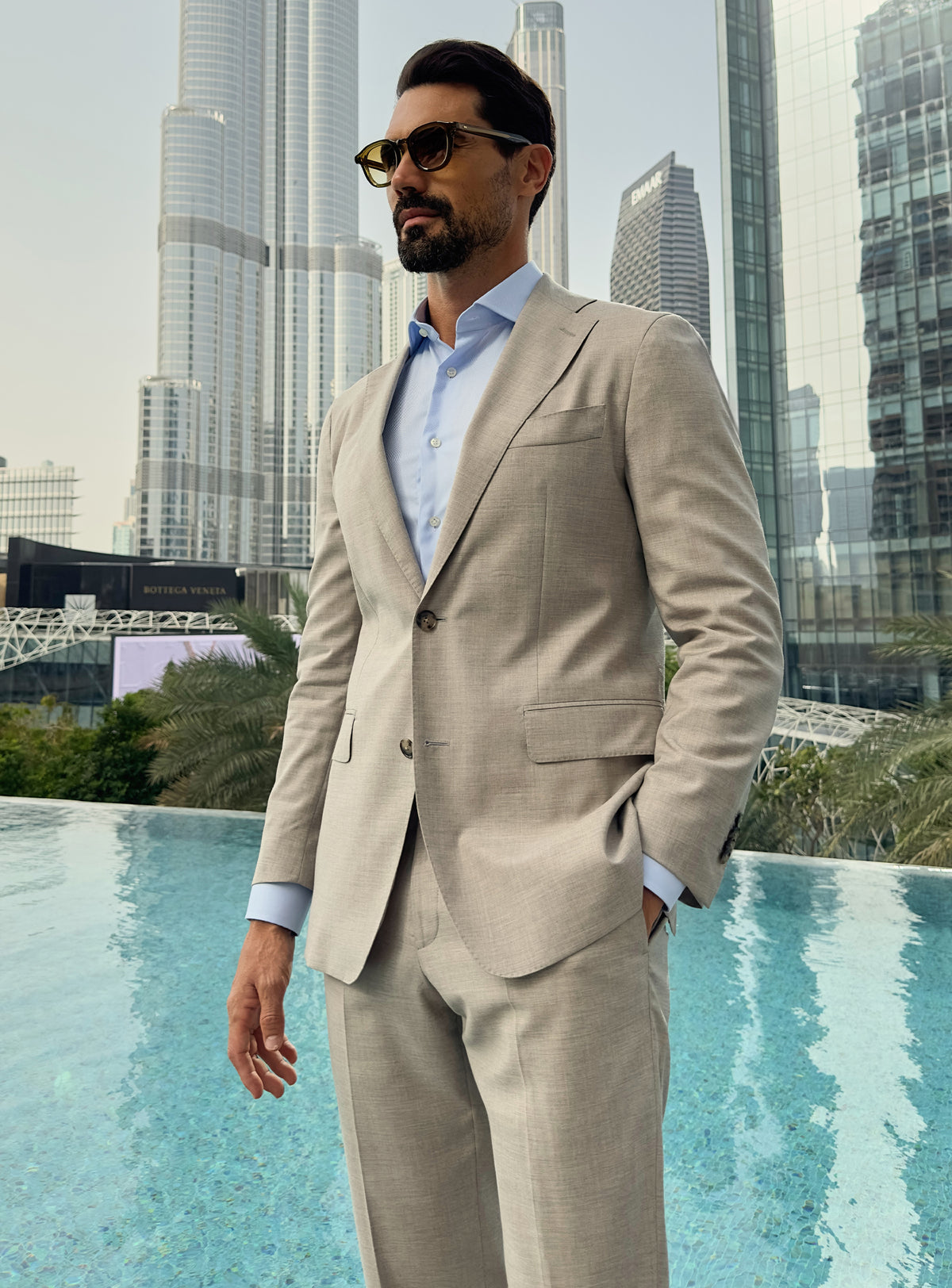 Light beige Consiglieri jacket worn with a pale blue shirt and no tie