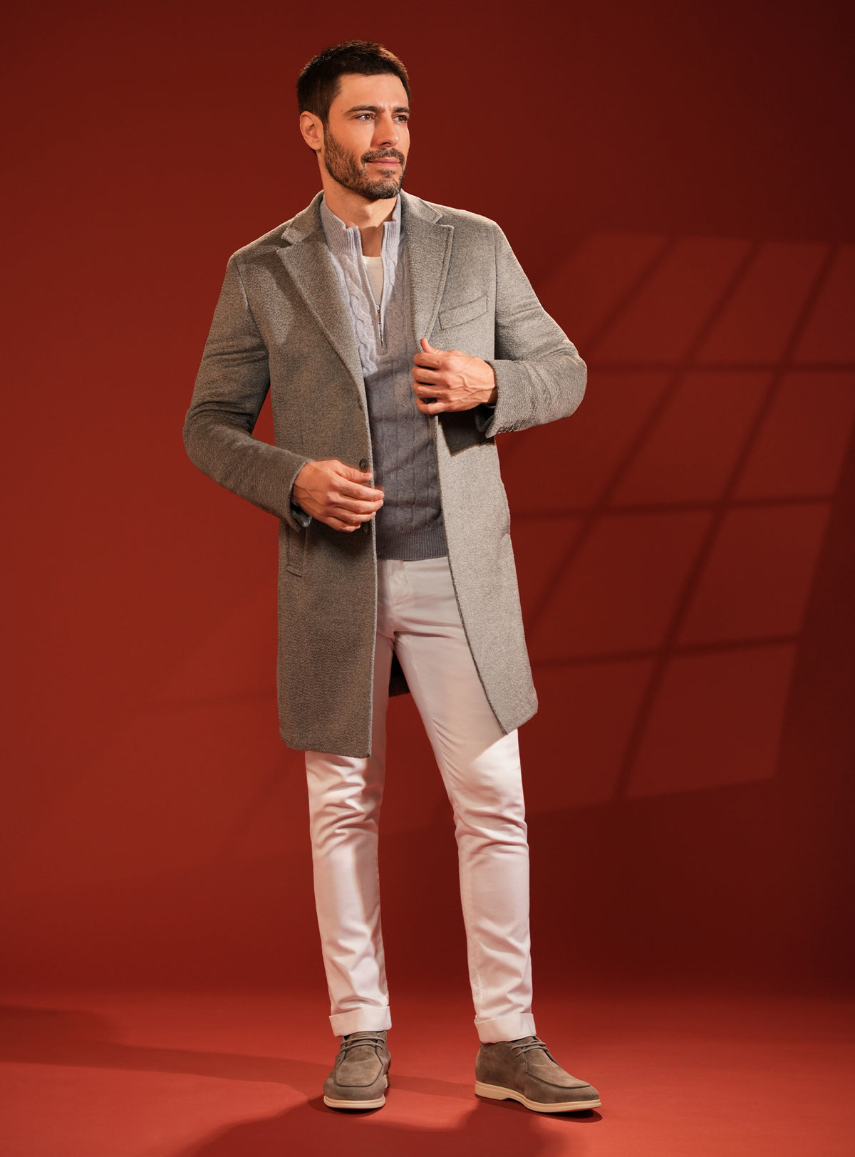 Grey-beige Consiglieri overcoat in a look with white trousers