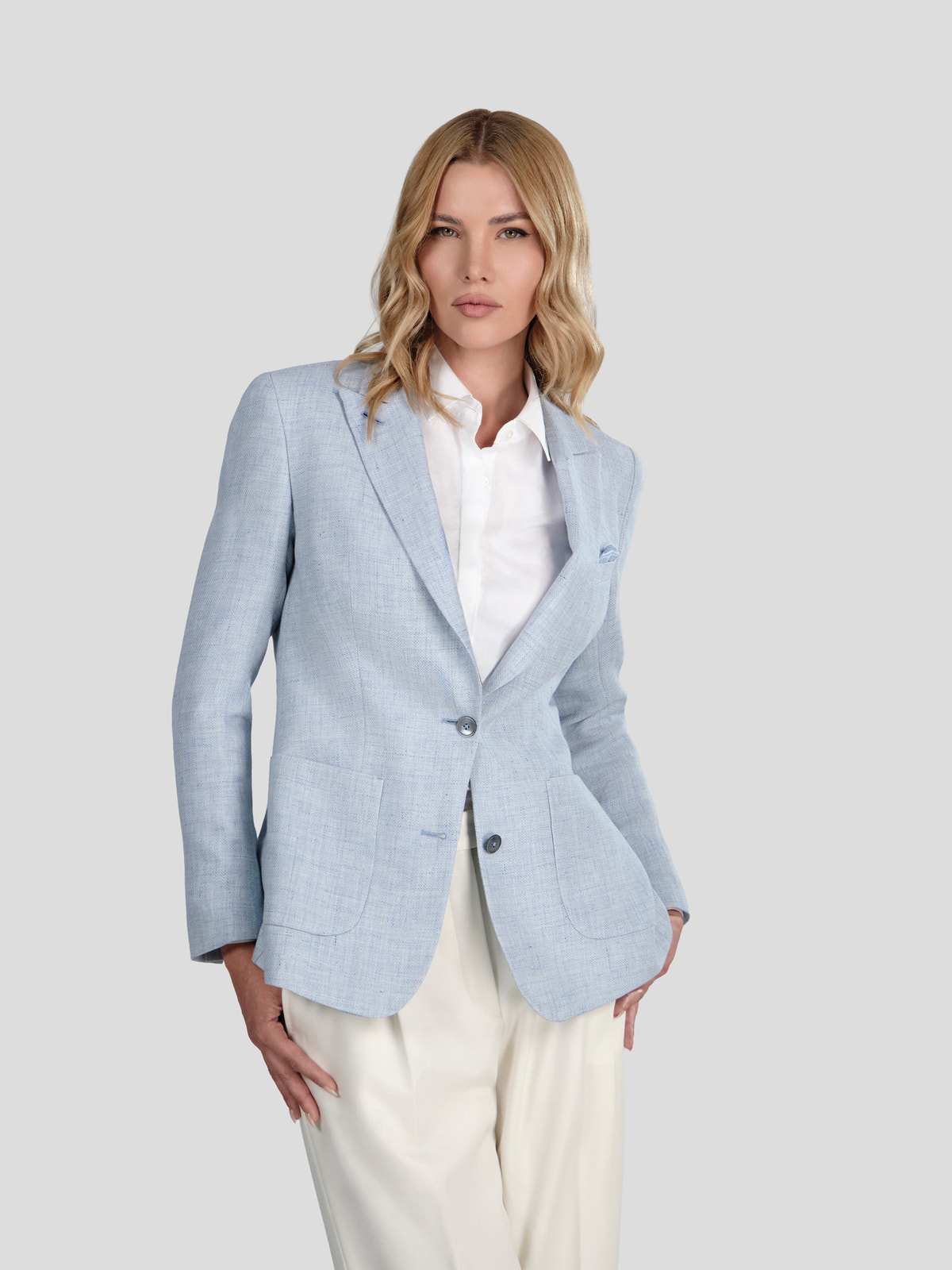 Light blue Consiglieri DONNA blazer with a white shirt and cream wide-leg trousers