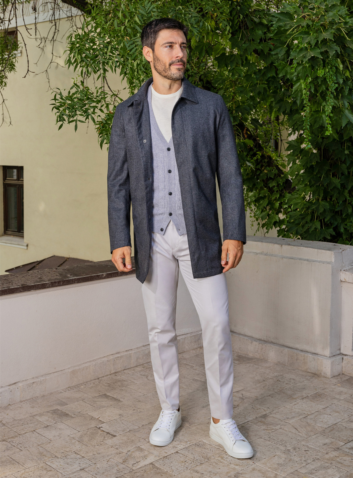 Consiglieri: light grey cardigan beneath a long navy jacket