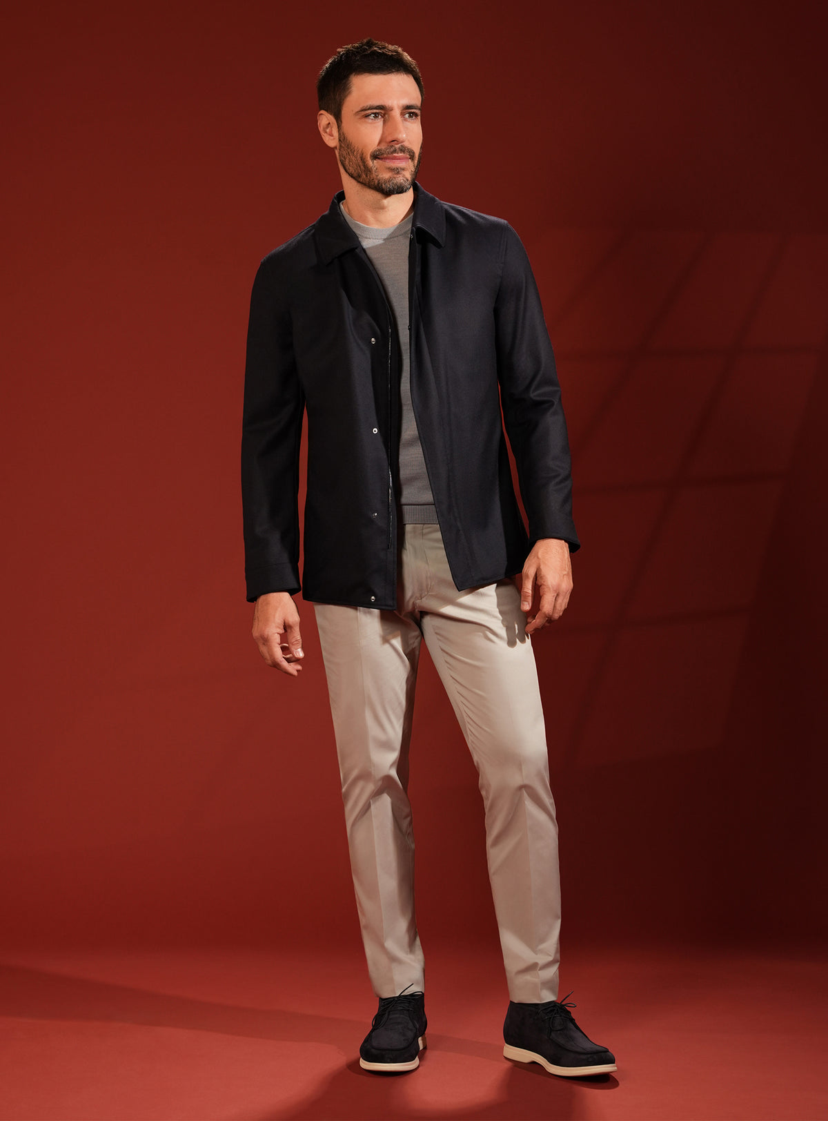 Deep navy Consiglieri jacket in a look with beige trousers