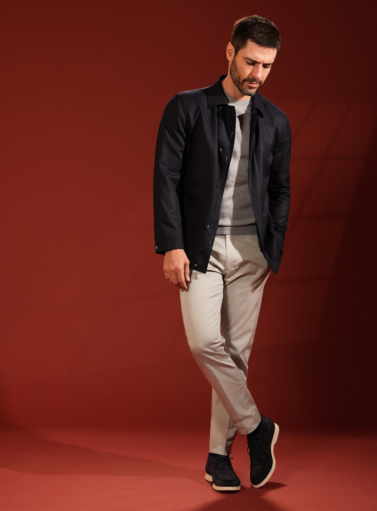 Deep navy Consiglieri jacket in a look with beige trousers