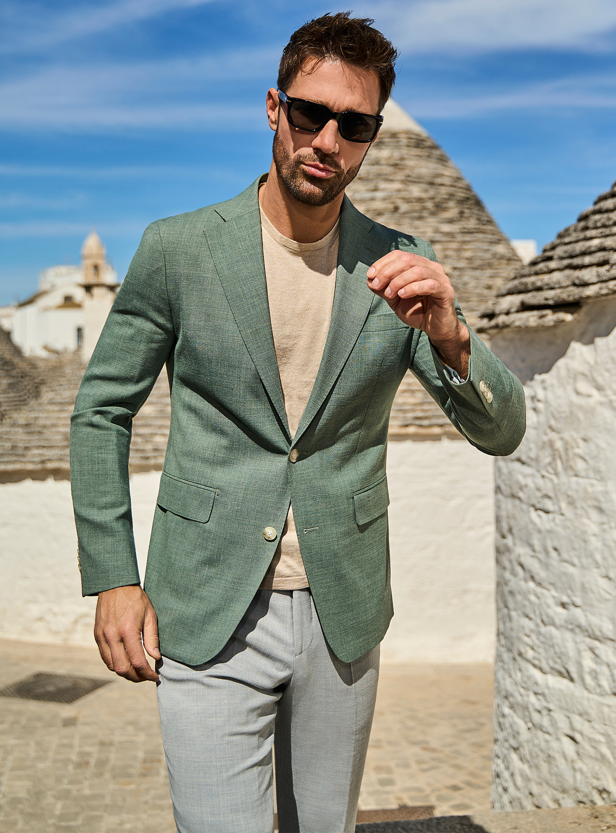 Consiglieri Novara's Noble: sage green jacket with a cream T-shirt and grey trousers