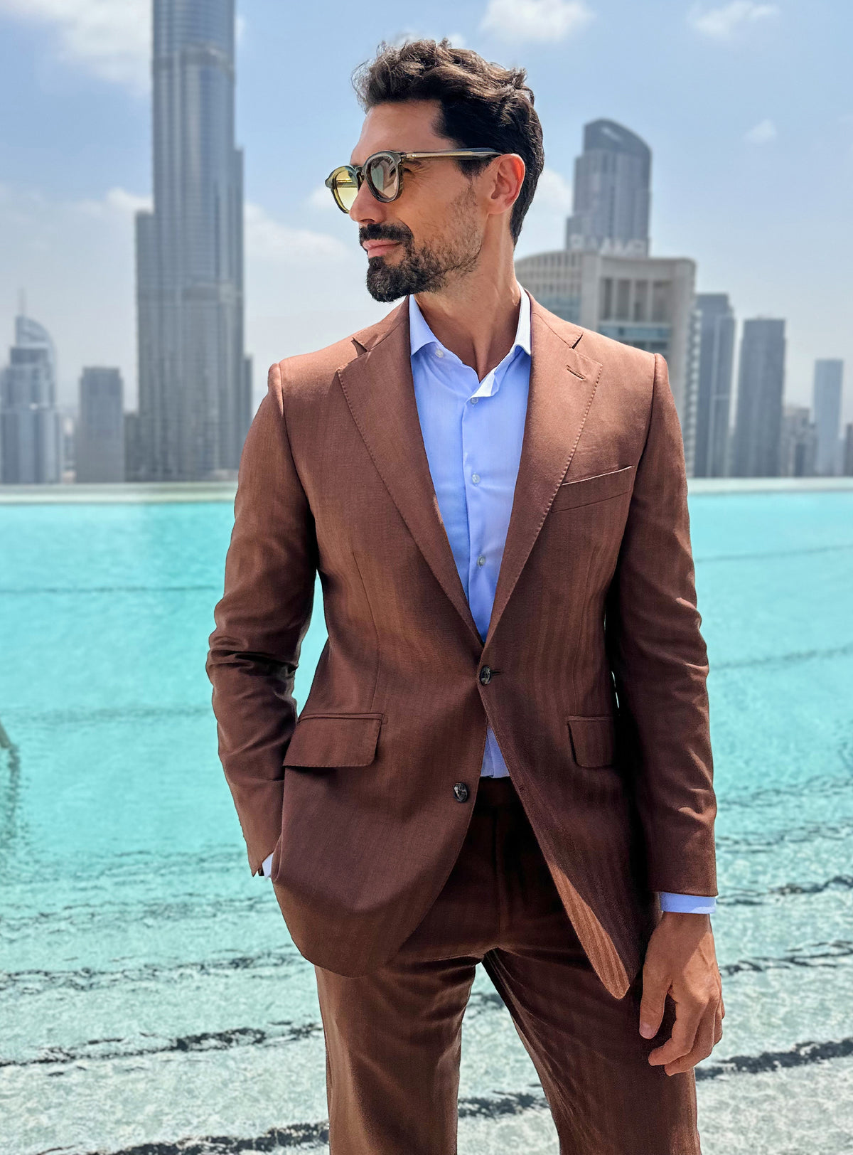 Terracotta Consiglieri jacket worn with a pale blue shirt and no tie