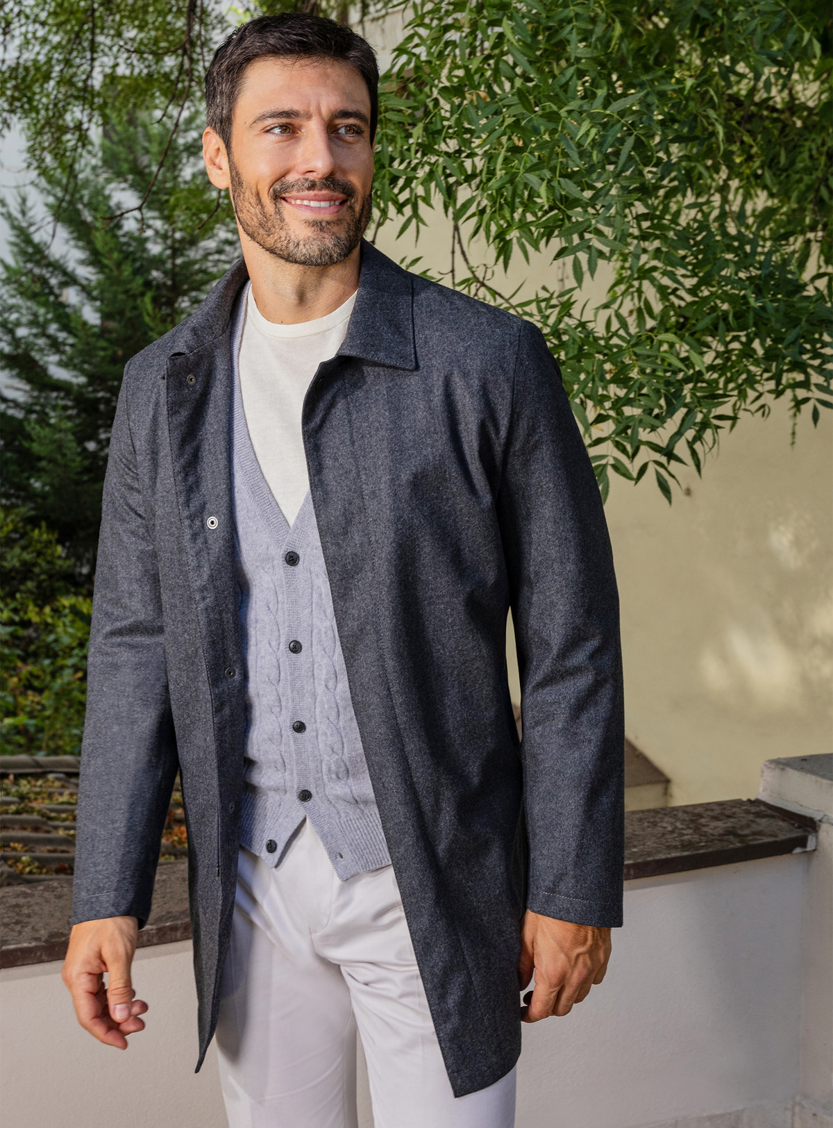 Consiglieri: light grey cardigan beneath a long navy jacket