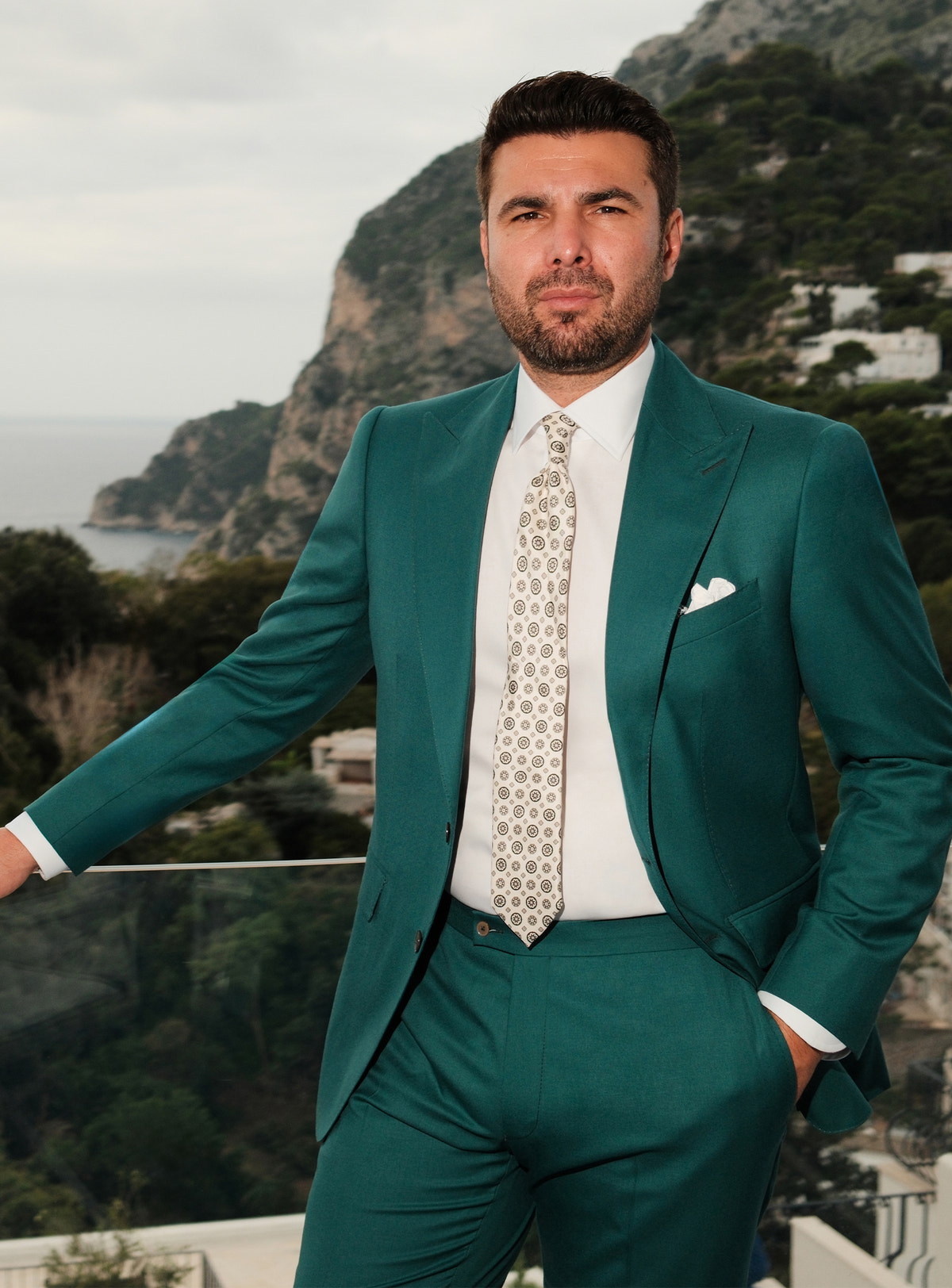 Teal Consiglieri suit worn with a white shirt and a light patterned tie
