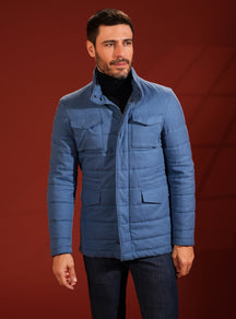 Blue quilted Consiglieri jacket with patch pockets and a navy turtleneck