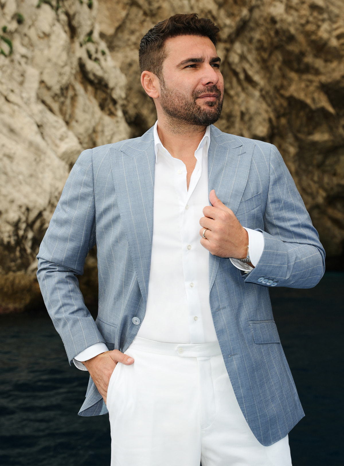 Pale blue Consiglieri blazer with a subtle check, worn with a white shirt and white trousers
