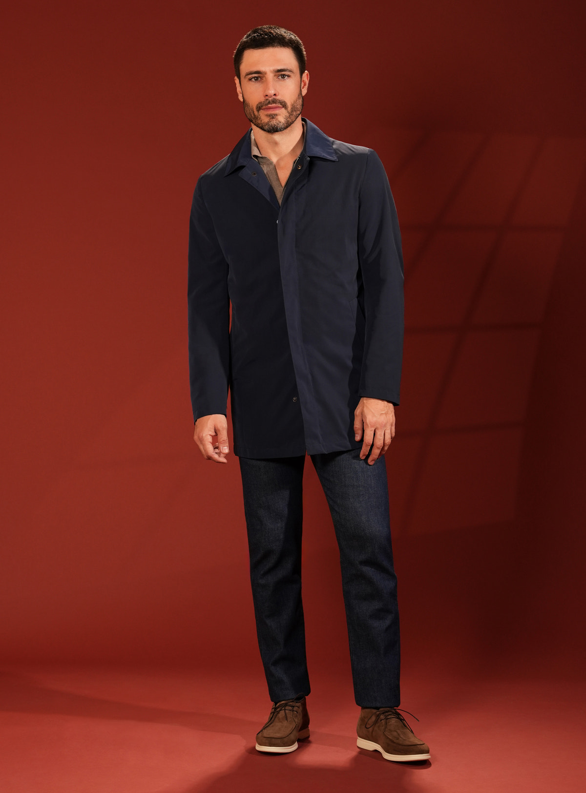 Navy Consiglieri short coat in a look with dark trousers and brown shoes