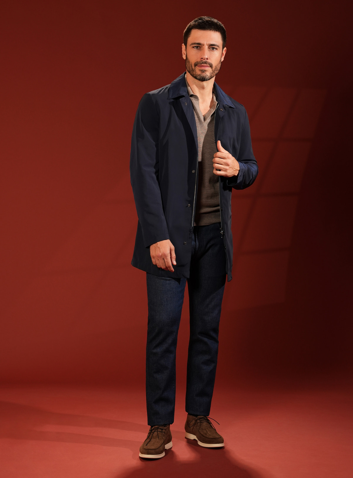 Navy Consiglieri short coat in a look with dark trousers and brown shoes