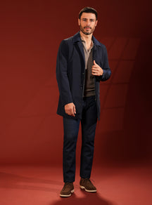 Navy Consiglieri short coat in a look with dark trousers and brown shoes